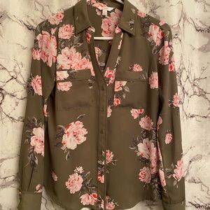 dark green blouse decorated with white and pink flowers